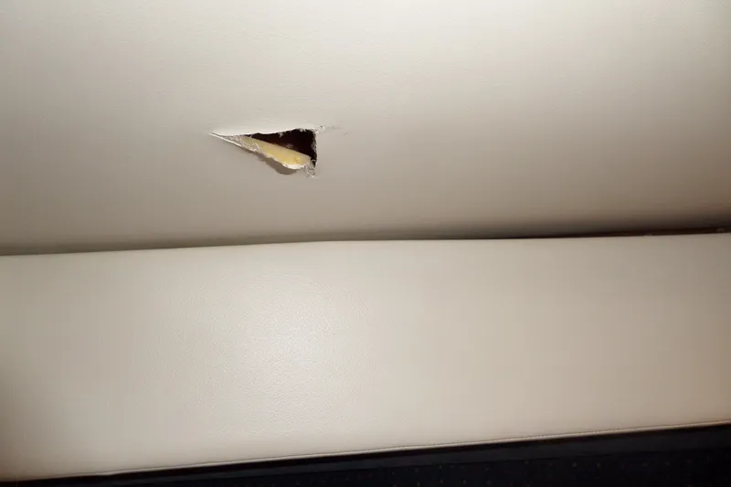 Slide: The Image of Torn upholstery on 2008 Bayliner 320 Cruiser boat seat. - 65