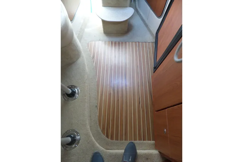 Slide: The Image of Interior view of 2008 Bayliner 320 Cruiser with wood flooring and carpeted steps. - 37