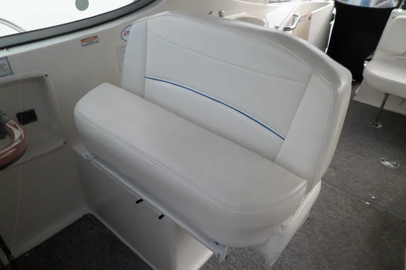 Slide: The Image of White seating area inside a 2008 Bayliner 320 Cruiser boat. - 20
