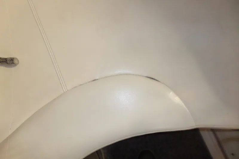 Slide: The Image of Close-up of 2008 Bayliner 320 Cruiser's white leather upholstery detail. - 64