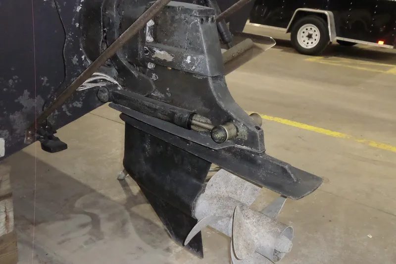 Slide: The Image of 2008 Bayliner 320 Cruiser outboard motor in a garage setting. - 60