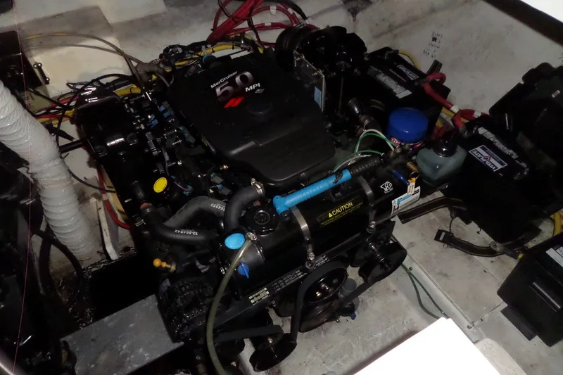 Slide: The Image of Engine compartment of a 2008 Bayliner 320 Cruiser with MerCruiser 5.0 MPI engine. - 58