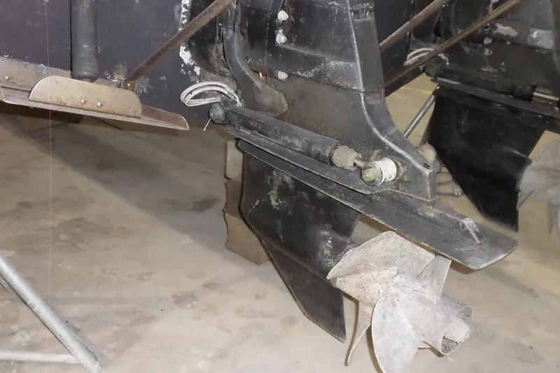 Slide: The Image of Close-up of 2008 Bayliner 320 Cruiser's propeller and stern drive in a garage. - 63