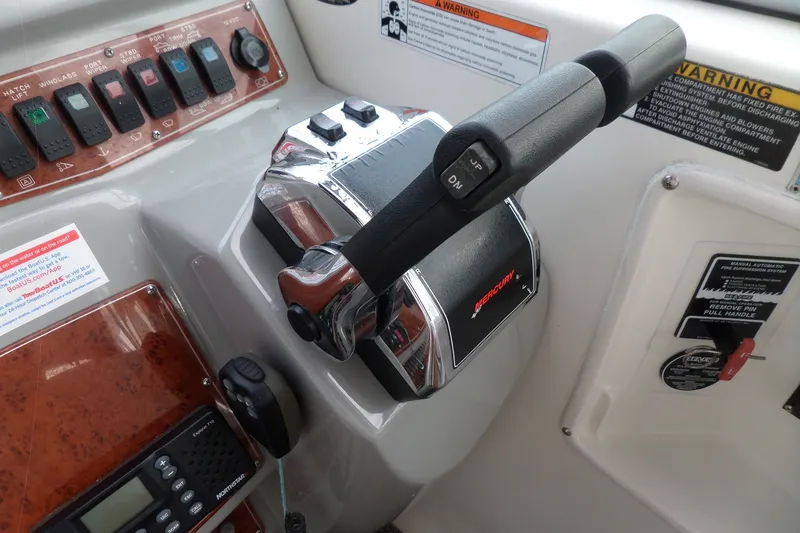 Slide: The Image of Control panel of a 2008 Bayliner 320 Cruiser with Mercury throttle and switches. - 15