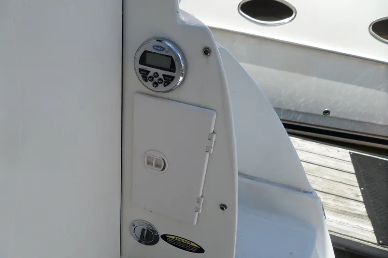 Slide: The Image of Control panel on a 2008 Bayliner 320 Cruiser boat, featuring a digital display. - 55