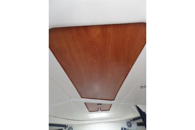 Slide: The Image of Interior ceiling of 2008 Bayliner 320 Cruiser with wood paneling and lighting. - 50