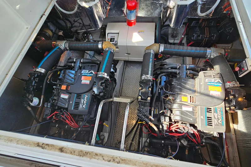 Slide: The Image of Engine room of a 1998 Trojan 400 Express boat with dual V8 engines. - 27