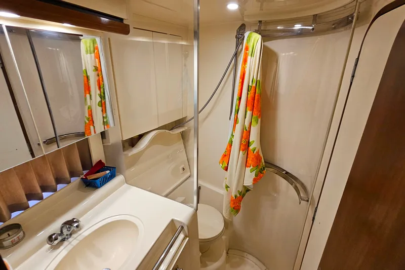 Slide: The Image of Bathroom interior of 1998 Trojan 400 Express yacht with shower and sink. - 38