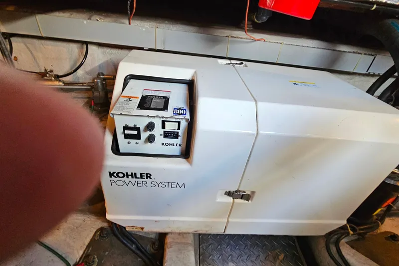 Slide: The Image of Kohler power system in a 1998 Trojan 400 Express boat engine room. - 26
