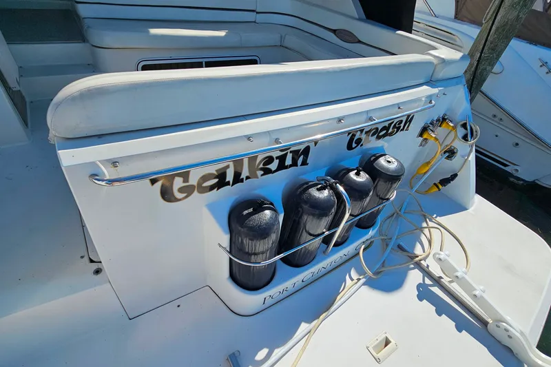 Slide: The Image of 1998 Trojan 400 Express boat stern with fenders and dock lines, Port Clinton. - 23