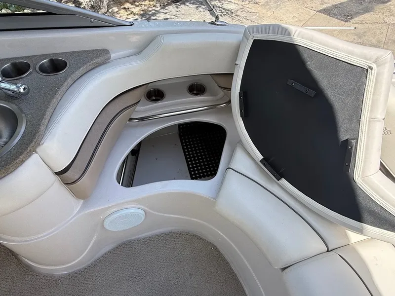 Slide: The Image of Interior of a 2006 Four Winns 240 Horizon with storage under the seats. - 20