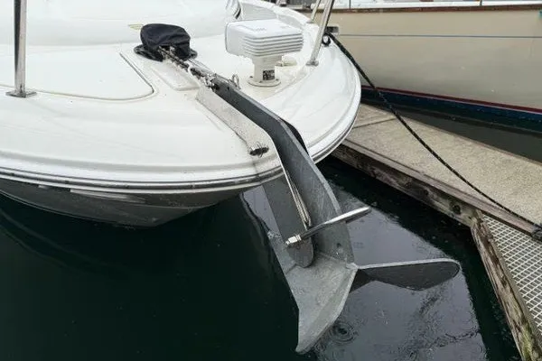 Slide: The Image of 2003 Sea Ray 380 Sundancer boat with anchor at marina dock. - 1