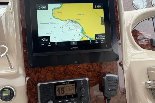 Slide: The Image of Garmin navigation system on 2003 Sea Ray 380 Sundancer boat dashboard. - 2