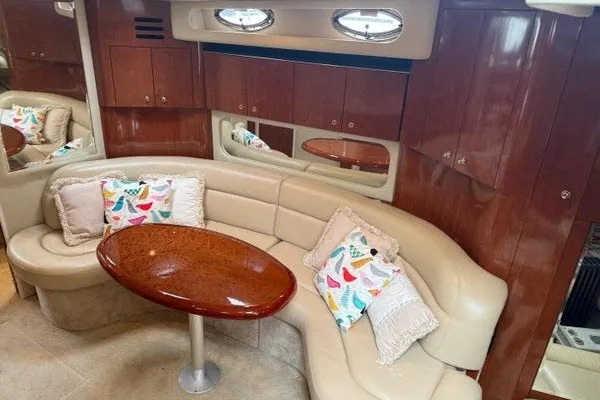Slide: The Image of Luxurious interior of 2003 Sea Ray 380 Sundancer with plush seating and elegant wood finishes. - 20