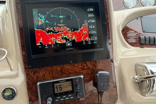 Slide: The Image of Control panel of a 2003 Sea Ray 380 Sundancer with Garmin navigation display. - 3