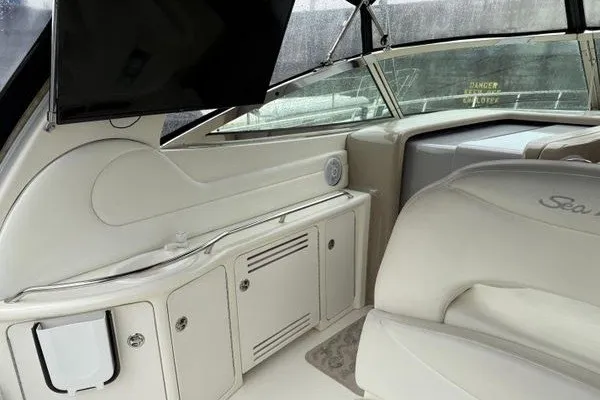 Slide: The Image of Interior of 2003 Sea Ray 380 Sundancer yacht with luxurious seating and cabinetry. - 13
