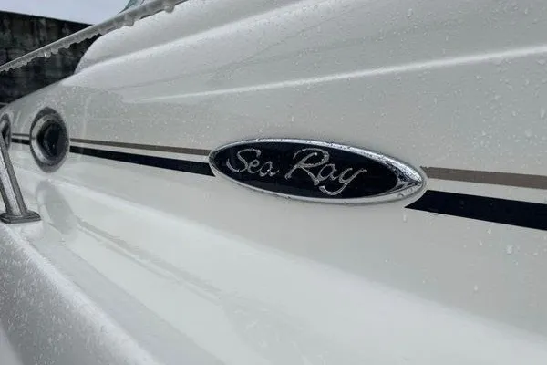 Slide: The Image of Close-up of 2003 Sea Ray 380 Sundancer boat emblem with raindrops. - 66