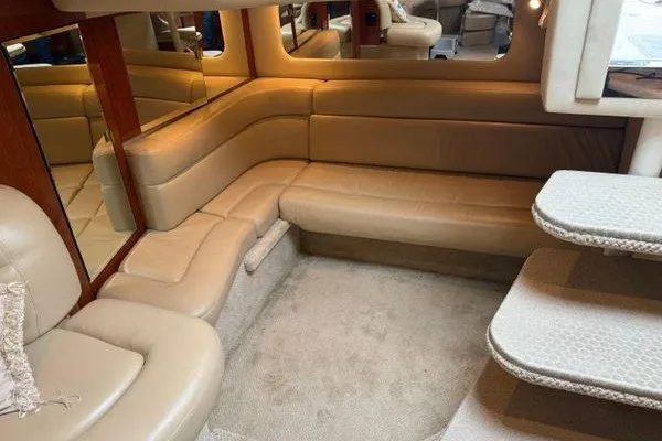 Slide: The Image of Luxurious interior of 2003 Sea Ray 380 Sundancer yacht with beige leather seating. - 46