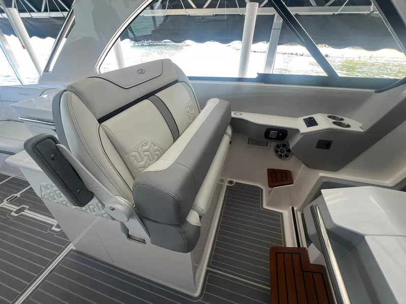 Slide: The Image of 2022 Regal LS36 boat interior with luxurious seating and modern controls. - 20