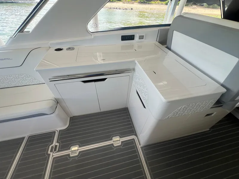 Slide: The Image of 2022 Regal LS36 boat interior with sleek white cabinetry and modern design. - 18