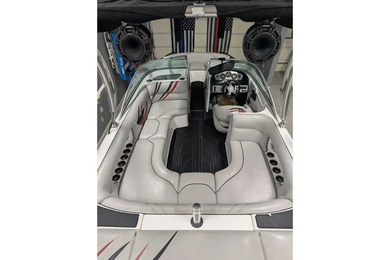 Slide: The Image of Interior of a 2011 MB F21 Tomcat boat with sleek seating and modern dashboard. - 4