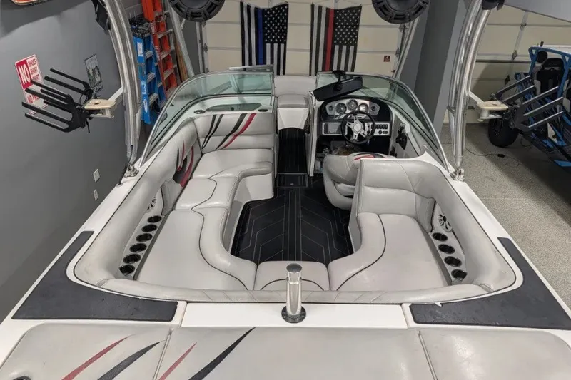 Slide: The Image of 2011 MB F21 Tomcat boat interior with white seating and modern dashboard. - 6