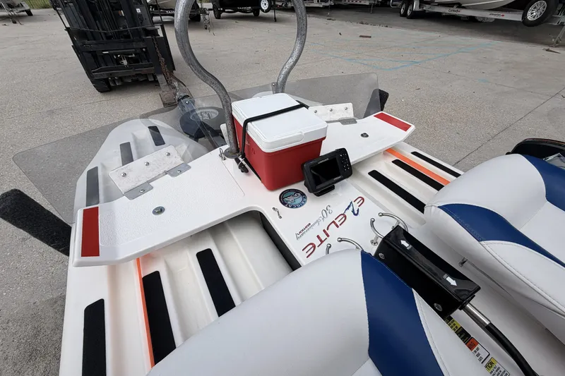 Slide: The Image of 2024 Craig Cat E2 Elite boat interior with seats, cooler, and control panel. - 10