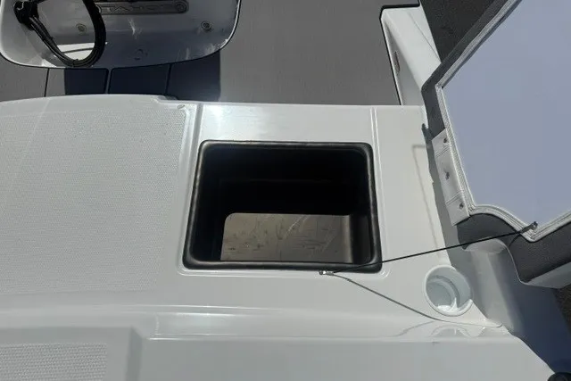 Slide: The Image of Open storage compartment on 2027 Tahoe T16 boat deck. - 20