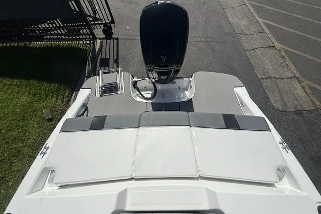 Slide: The Image of 2027 Tahoe T16 boat with sleek deck design and powerful outboard motor. - 19