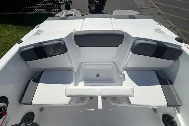 Slide: The Image of 2027 Tahoe T16 boat interior with gray and white seating arrangement. - 18