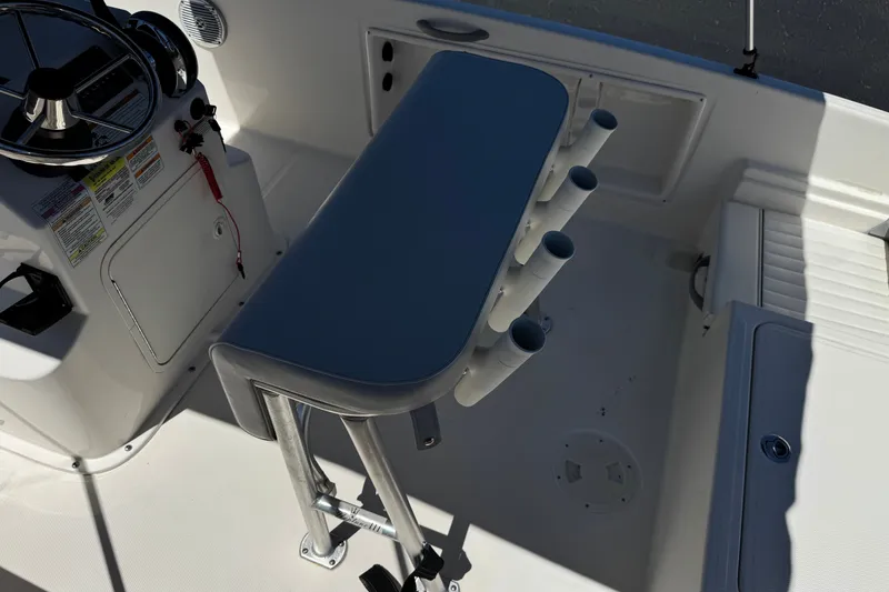 Slide: The Image of 2022 Trophy T18 Bay boat interior with steering console and rod holders. - 20