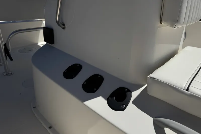 Slide: The Image of Interior view of a 2022 Trophy T18 Bay boat, featuring seating and rod holders. - 13