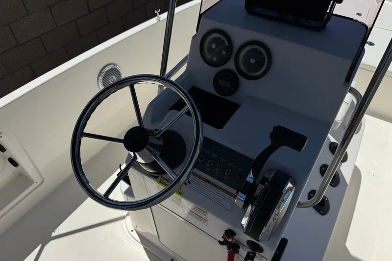 Slide: The Image of Steering console of a 2022 Trophy T18 Bay boat with gauges and controls. - 23