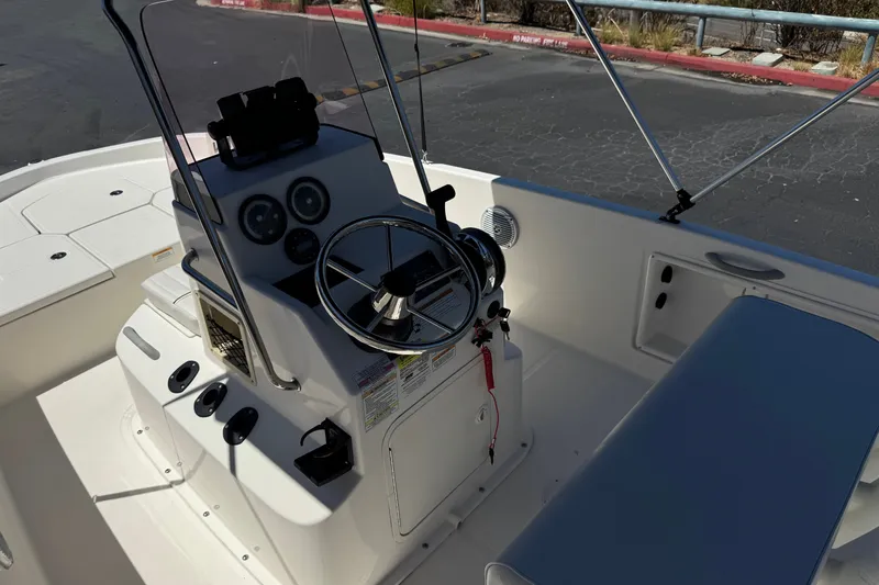 Slide: The Image of 2022 Trophy T18 Bay boat interior with steering console and seating. - 21