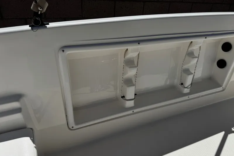 Slide: The Image of Interior view of a 2022 Trophy T18 Bay boat, showcasing storage compartments. - 19