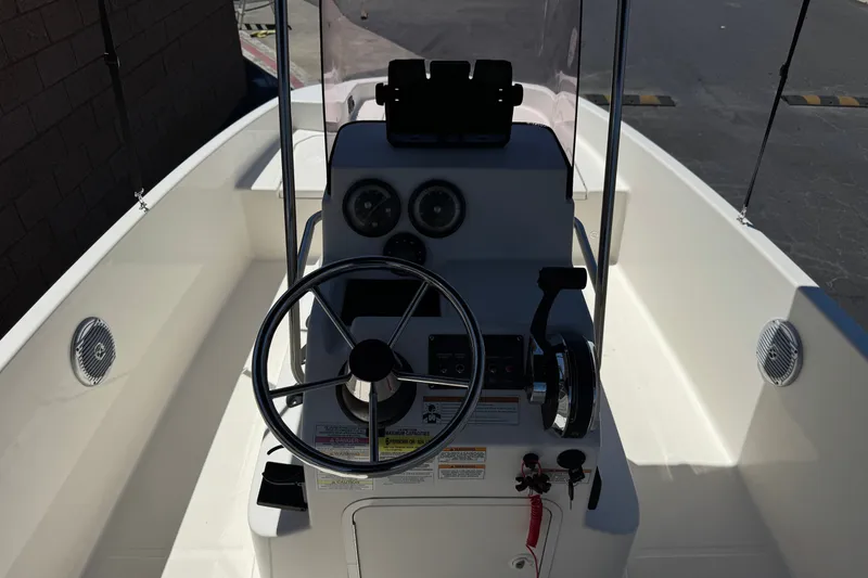 Slide: The Image of 2022 Trophy T18 Bay boat cockpit with steering wheel and control panel. - 22