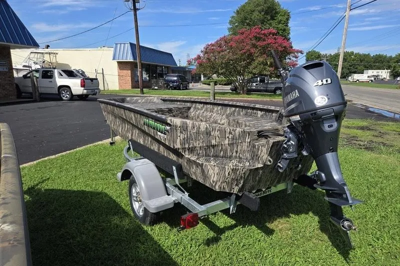 Slide: The Image of Camouflage-patterned 2026 Havoc 1553 VJST boat with Yamaha 40 engine on trailer. - 6