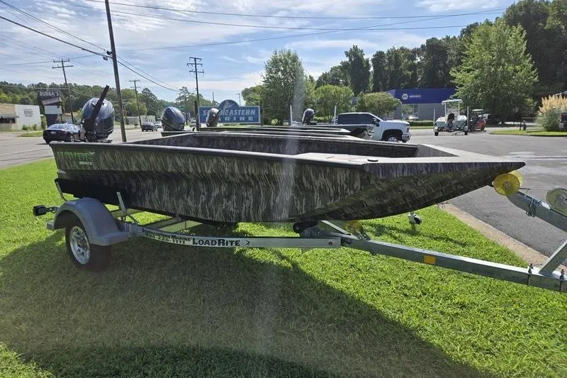 Slide: The Image of 2026 Havoc 1553 VJST boat on LoadRite trailer, parked on grass. - 5