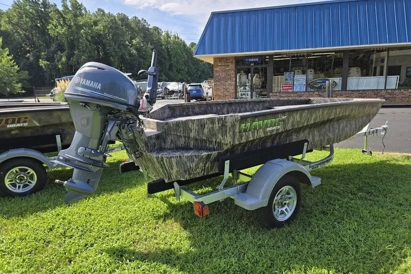 Slide: The Image of 2026 Havoc 1553 VJST boat with Yamaha motor on trailer, parked on grass. - 12