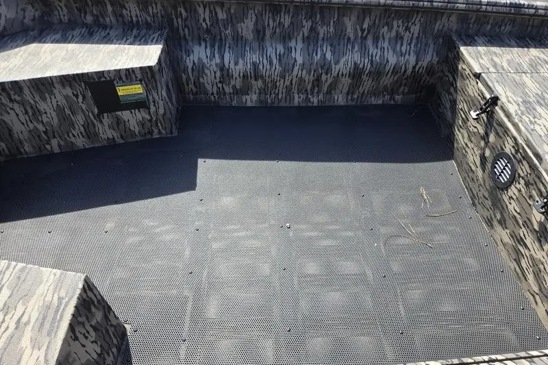 Slide: The Image of Interior of 2026 Havoc 1553 VJST boat with camouflage design and textured flooring. - 13