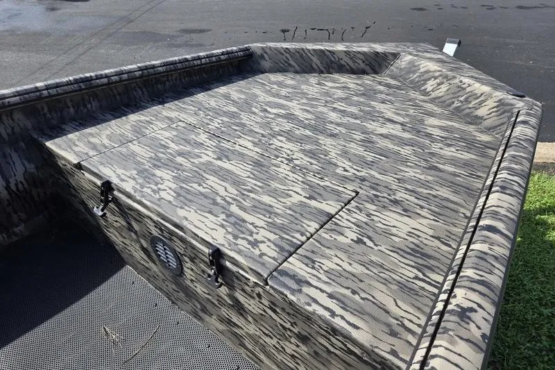 Slide: The Image of Camouflage-patterned deck of 2026 Havoc 1553 VJST boat, featuring storage compartments. - 4