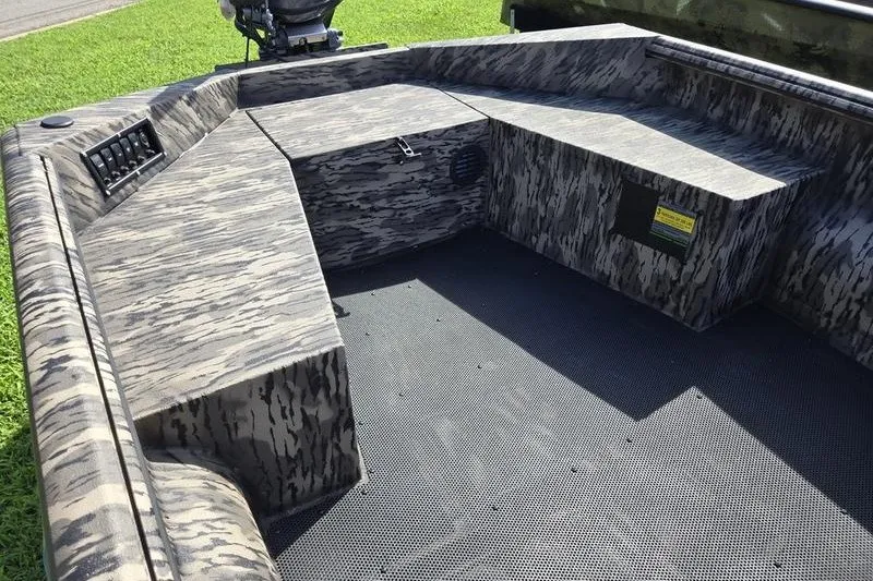 Slide: The Image of 2026 Havoc 1553 VJST boat interior with camouflage design and seating area. - 14