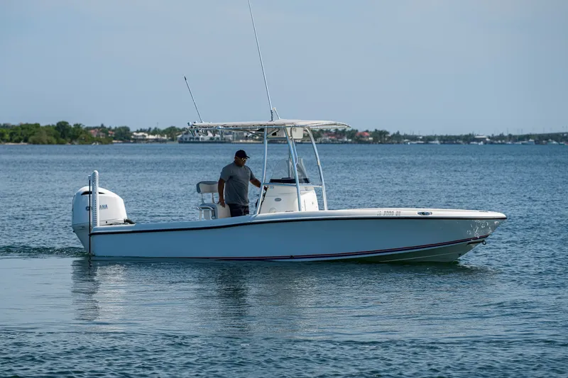 Slide: The Image of 2010 Hydra-Sports Bay Bolt 23 boat cruising on calm water. - 2