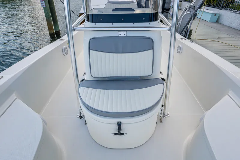 Slide: The Image of 2010 Hydra-Sports Bay Bolt 23 boat interior with cushioned seating and console. - 10