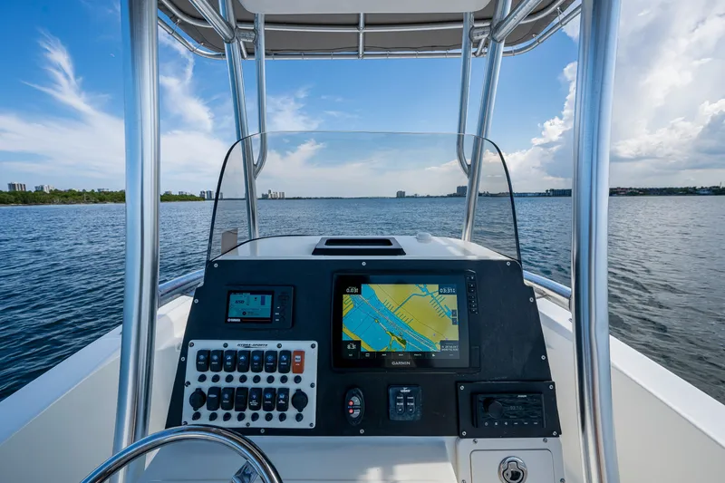 Slide: The Image of 2010 Hydra-Sports Bay Bolt 23 boat dashboard with navigation system on open water. - 12