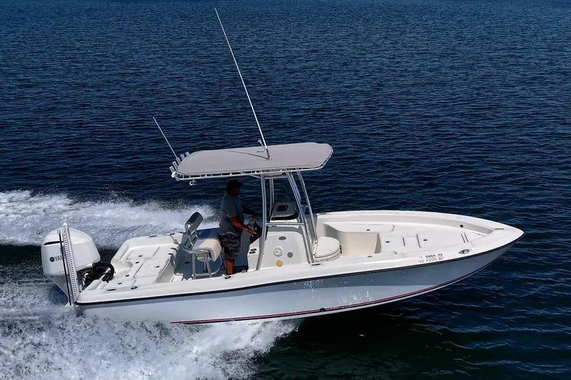 Slide: The Image of 2010 Hydra-Sports Bay Bolt 23 boat cruising on open water with a Yamaha engine. - 0