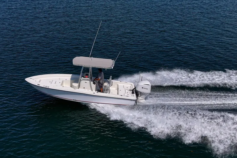 Slide: The Image of 2010 Hydra-Sports Bay Bolt 23 boat cruising on open water. - 21