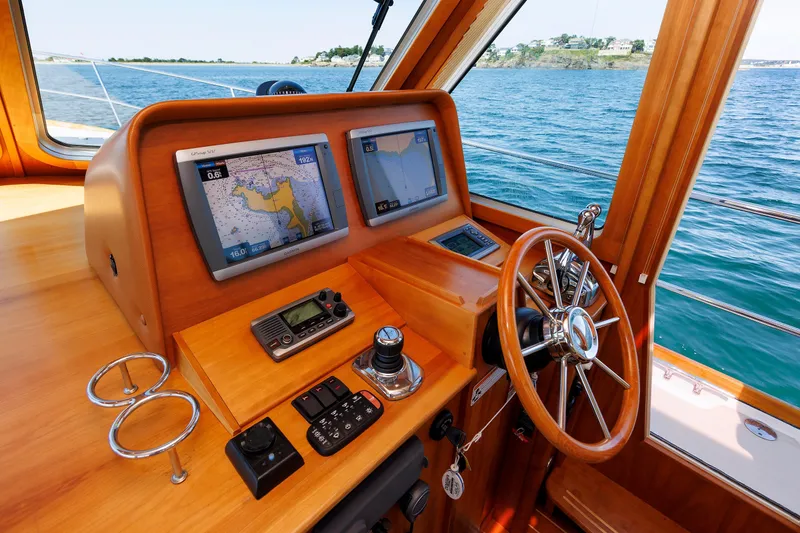 Slide: The Image of Helm of 2013 Sabre 42 Salon Express with navigation screens and steering wheel. - 26