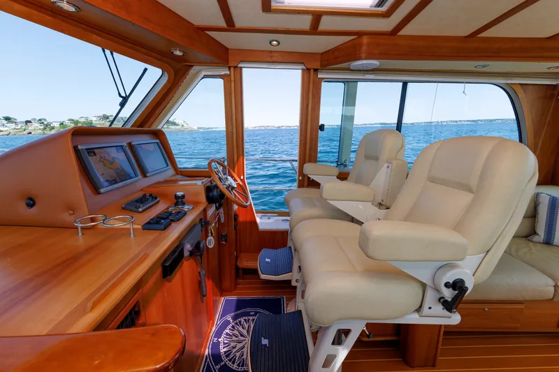 Slide: The Image of Interior of 2013 Sabre 42 Salon Express yacht with luxurious seating and navigation controls. - 27
