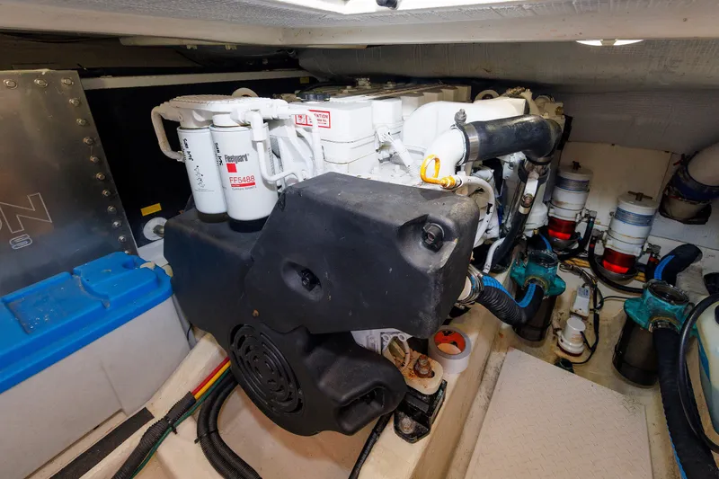 Slide: The Image of Engine room of 2013 Sabre 42 Salon Express, showcasing mechanical components and filters. - 46